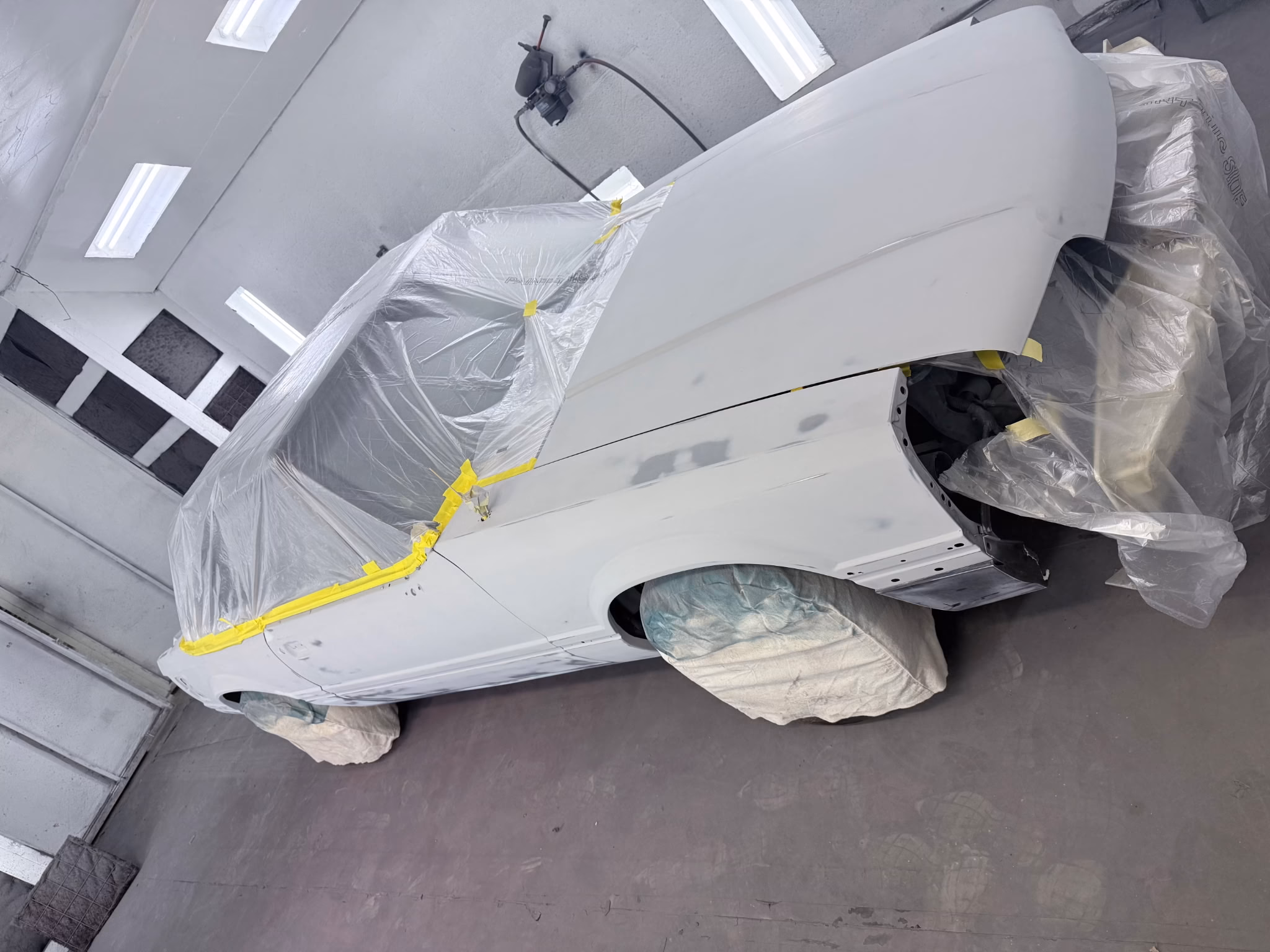 1987 Fox-body Mustang convertible masked and staged in the paint booth at Rippers Body Shop, West Sacramento CA